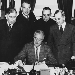 Franklin D. Roosevelt signs the New Deal