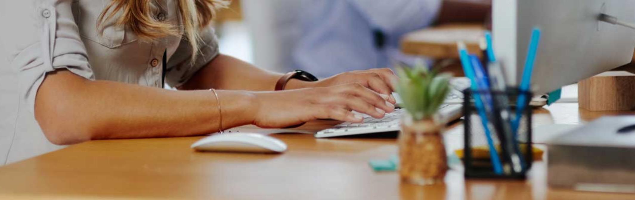 woman seated at a computer